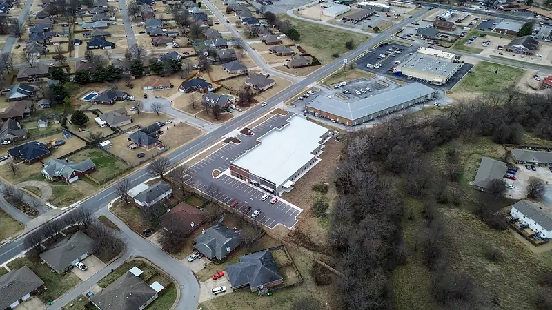 Front and side lots, with the tree line behind