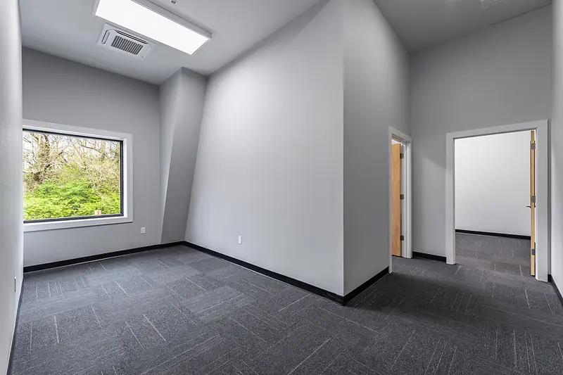 Suite 134: office with a window on the trees