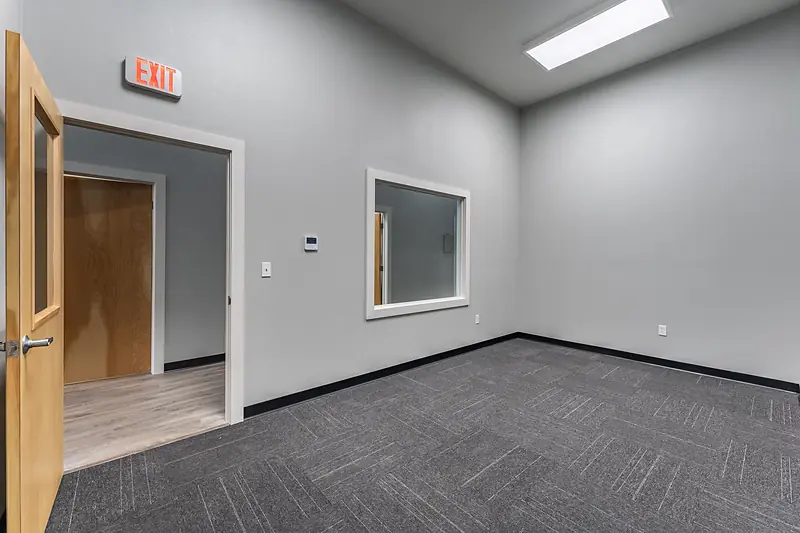 Suite 138: reception area, with its door and window onto the main hall